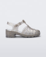 Side view of a clear glitter gold kids Possession Heel sandal