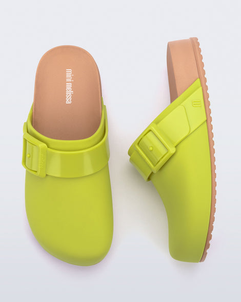 Top and side view of a pair of green kids Cozy Clogs