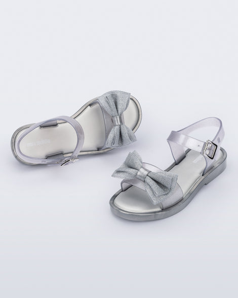 Angled view of a pair of pearly silver Mar Sweet kids sandals