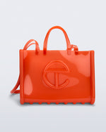 Front view of the orange Large Jelly Shopper x Telfar bag