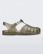 Side view of a glitter green Possession sandal