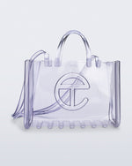 Angled view of the clear Large Jelly Shopper x Telfar bag