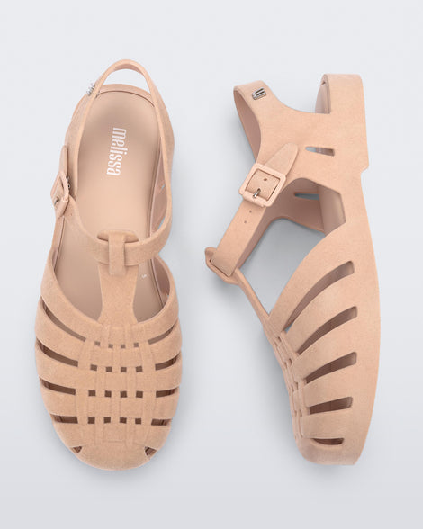 Side and top view of a pair of light pink Possession Velvet sandals.