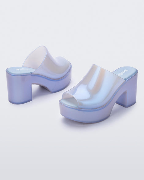 Angled view of a pair of pearly blue Mule Hype heel platforms