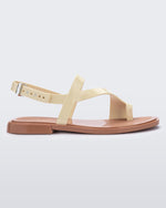 Side view of a beige Cassie sandal