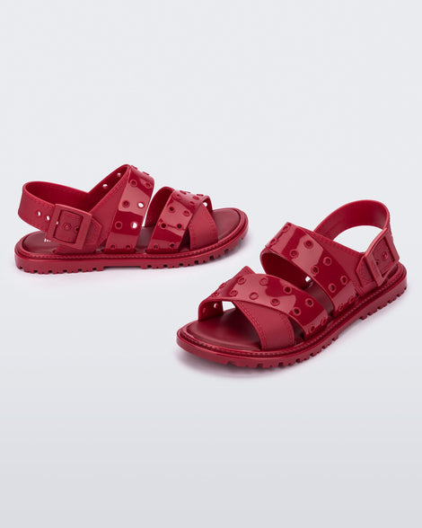 Side and angled view of a pair of red Lock sandals with back strap