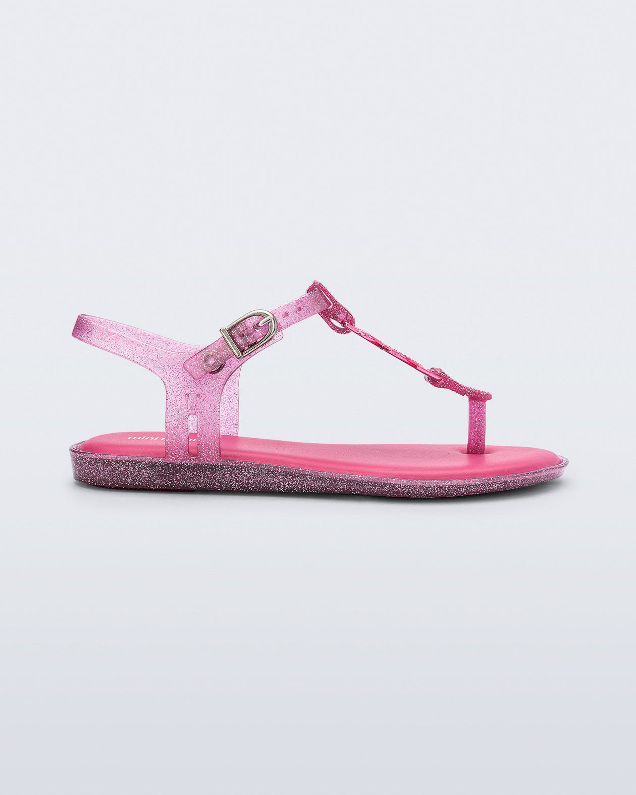 Side view of a pink glitter Solar kids sandal