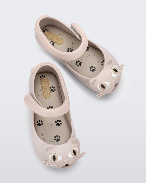 Top view of a pair of beige baby Ultragirl Cat flats