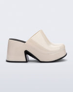 Side view of a beige Mia Platform Mule Heel with black sole