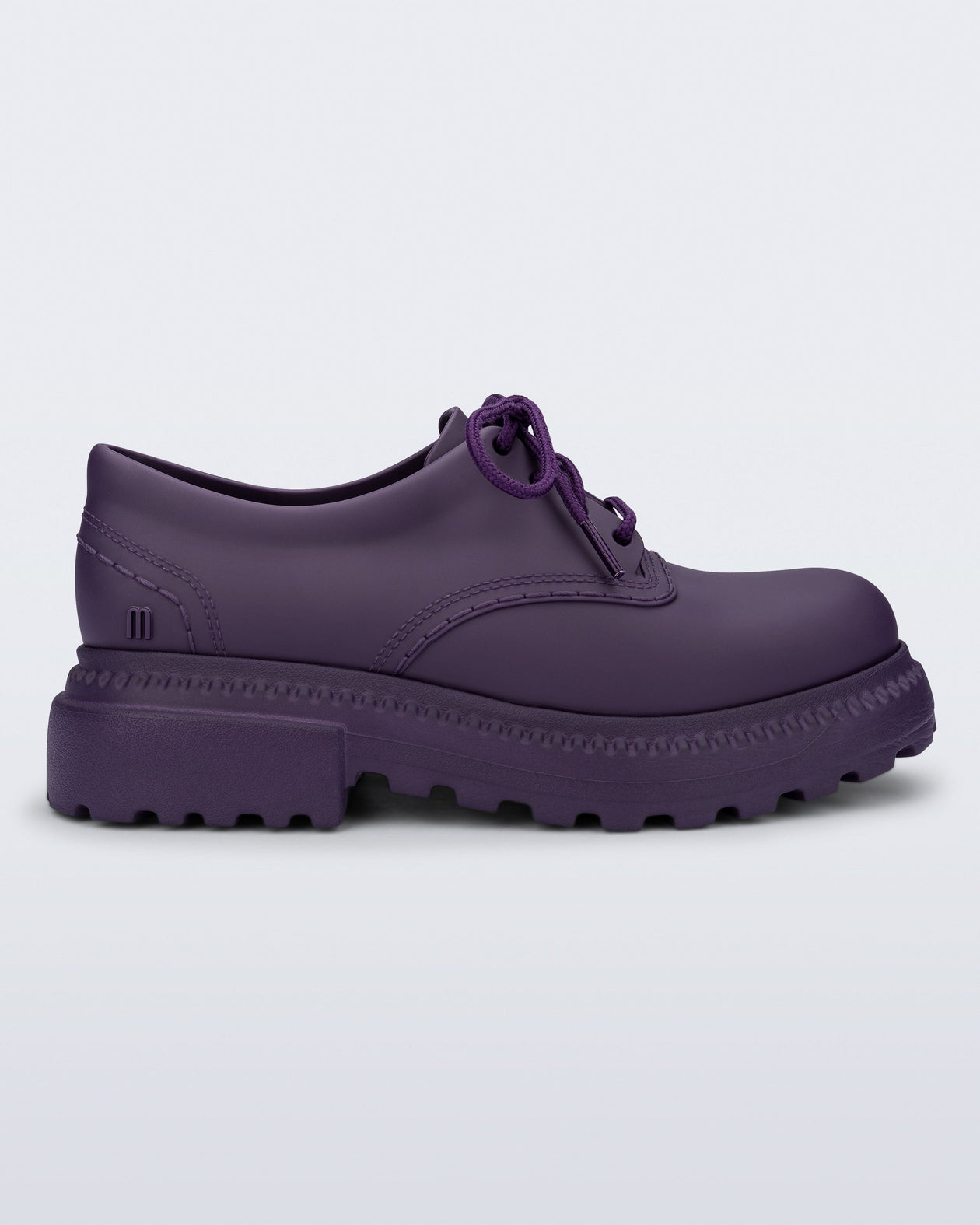 Side view of a matte purple Charlotte adult sneaker loafer with laces