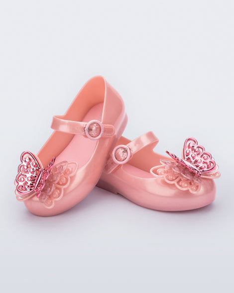 Angled view of a pair of pink Sweet Love baby flats