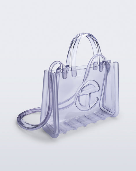 Angled view of the clear Medium Jelly Shopper x Telfar bag