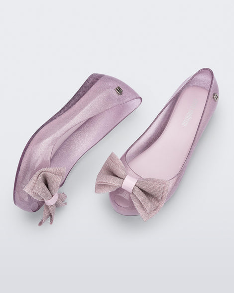 Top and side view of a pair of glitter pink Ultragirl Sweet kids ballerina flats with bow