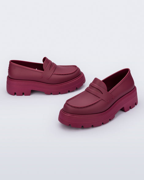 Angled view of a pair of matte red Royal adult loafers