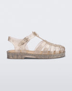 Side view of a glitter beige kids Possession sandal