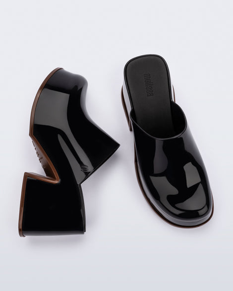 Top and side angled view of a pair of black Mia Platform Mule Heels with brown sole