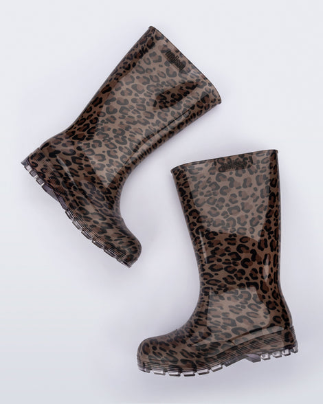 Side angled view of a pair of brown/black leopard print Welly rainboots.