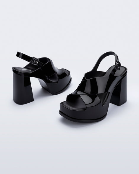 Angled view of a pair of black Dance Heel platforms