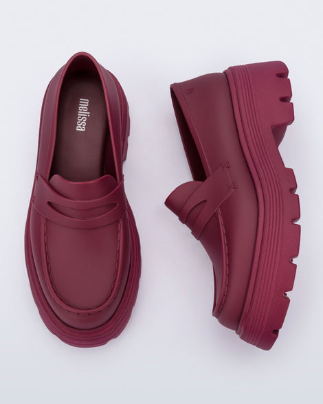 Top and side view of a pair of matte red Royal adult loafers