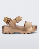 Side view of a gold Kick Off Sandal