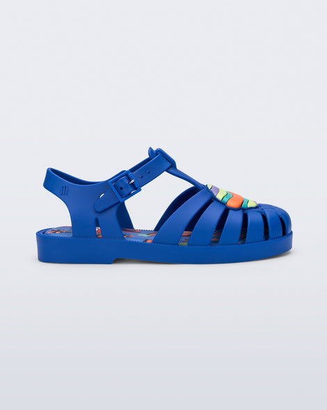 Side view of a blue kids Possession + Play Doh sandal