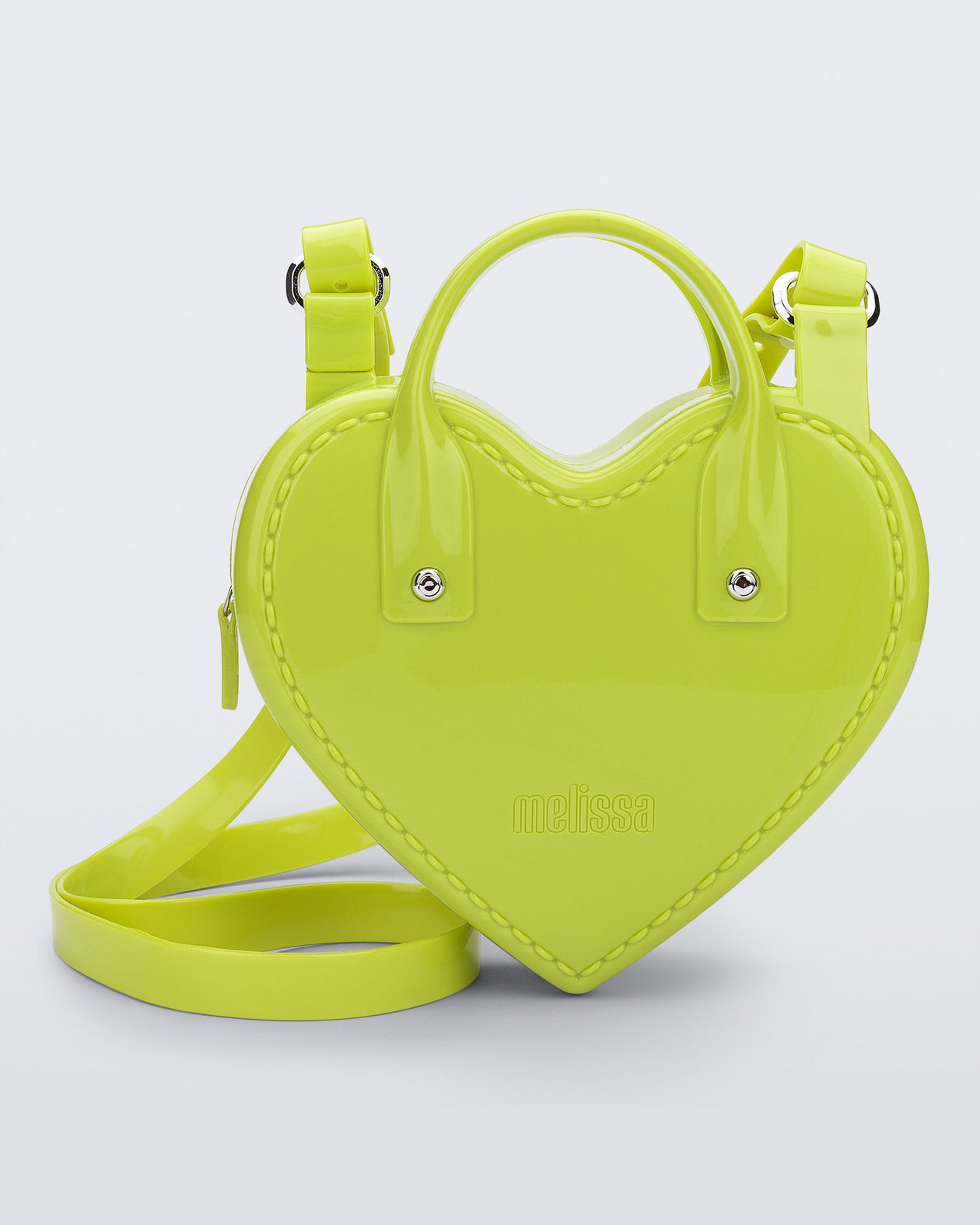 Front view of a green Heartbeat bag with small handles and longer strap.