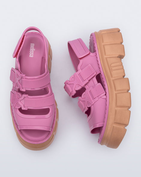 Side and top view of a pair of Pink Rebel platform Sandals with back strap.