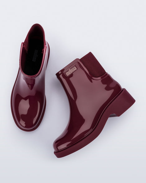 Top and side view of a pair of burgundy red Chelsea Boots.