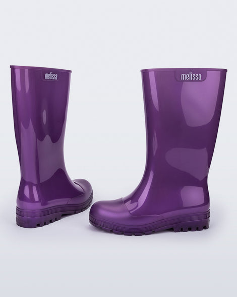 Back and side view of a pair of purple Welly rainboots.