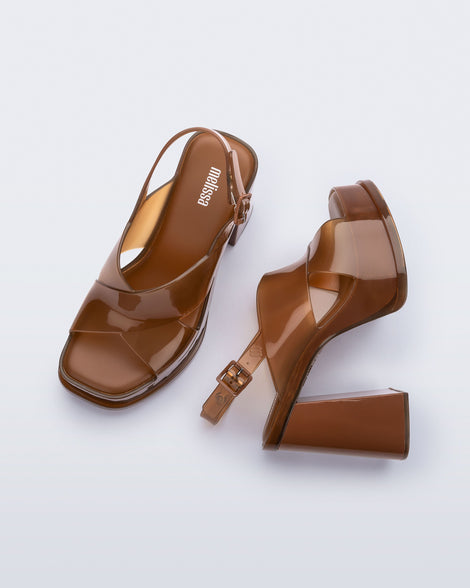 Top and side view of a pair of brown Dance Heel platforms