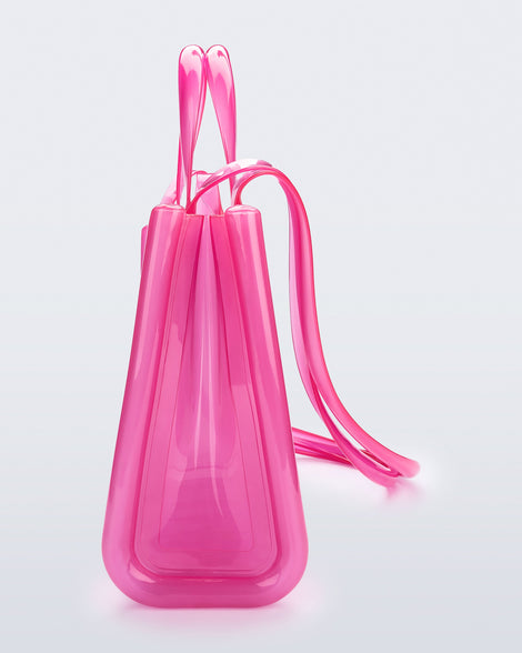 Side view of the pink Medium Jelly Shopper x Telfar bag