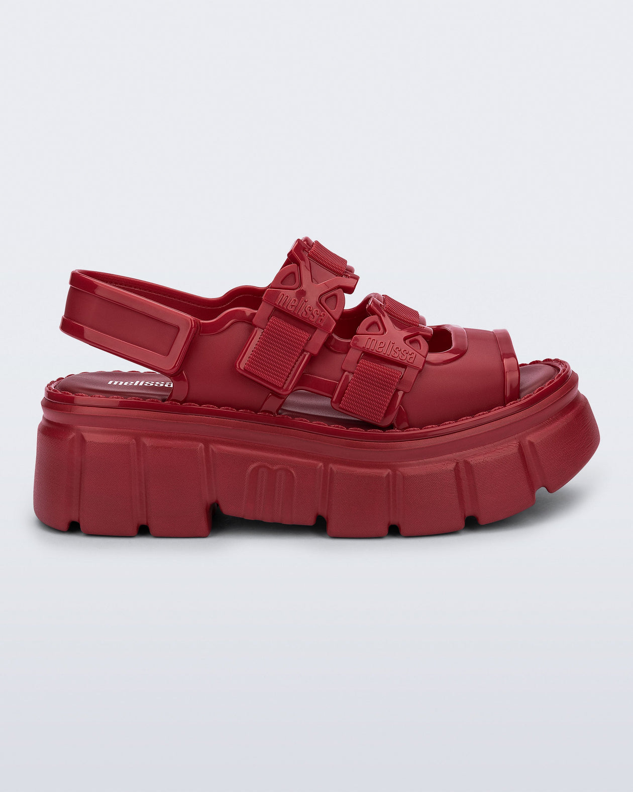 Side view of a red Rebel platform Sandal with back strap