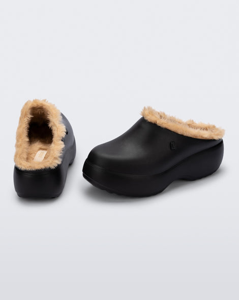 Back and side view of a pair of black Free Clog Fluffy Platforms with dark beige fluffy liner