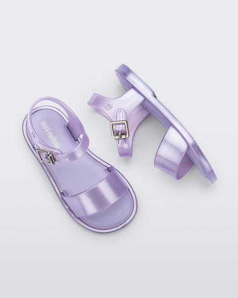 Top and side view of a pair of pearly lilac baby Mar Sandals