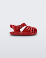 Side view of a red baby My First Mini Melissa Possession sandal