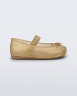 Side view of a pearly beige Sophie baby ballerina flat with bow