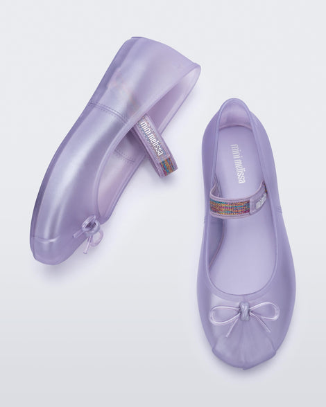 Top and side view of a pair of lilac kids Sophie flats