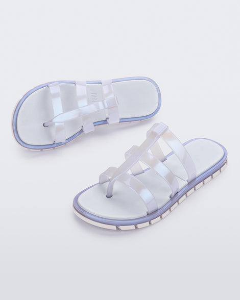 Top and angled view of a pair of pearly blue Path adult sandals with  blue sole