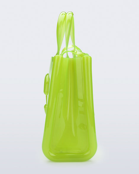 Side view of the green Medium Jelly Shopper x Telfar bag