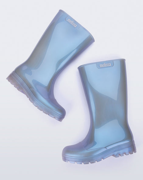 Side angled view of a pair of pearly blue Welly rainboots.