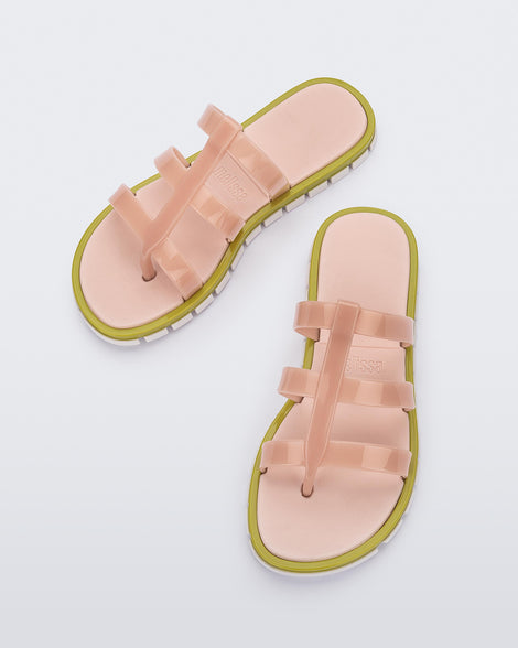 Top view of a pair of pink Path adult sandals with  green sole