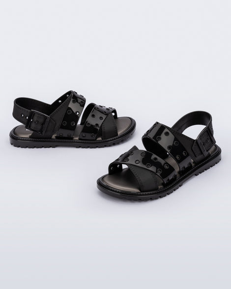 Side and angled view of a pair of black Lock sandals with back strap