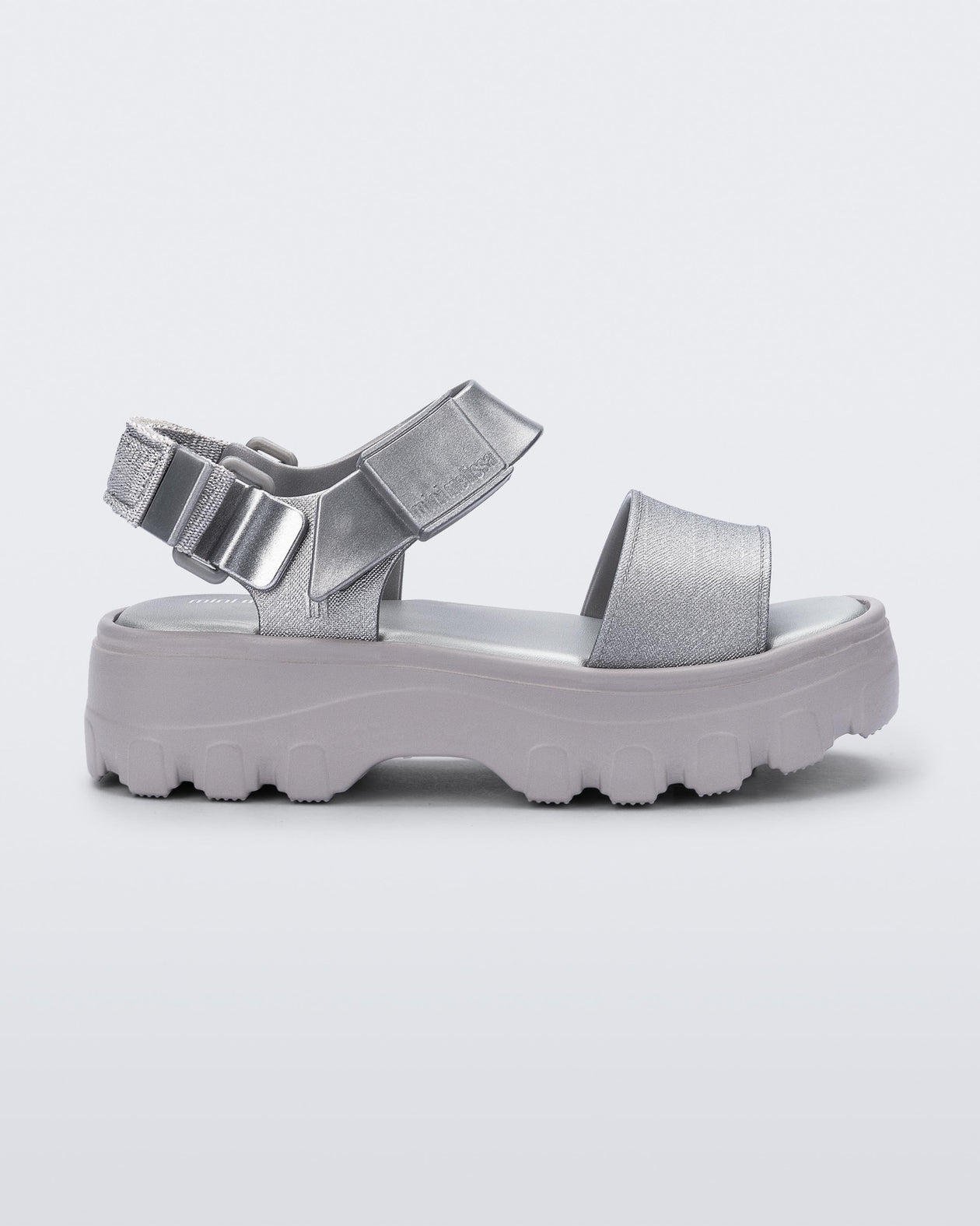 Side view of a silver kids Kick Off Sandal