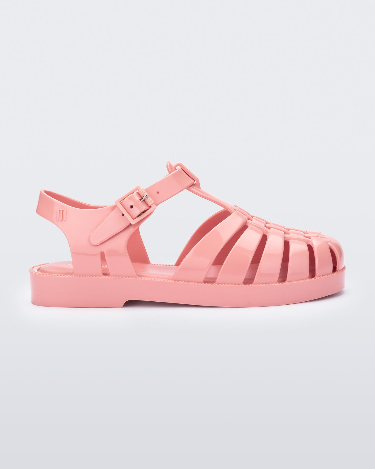 Side view of a light pink kids Possession sandal