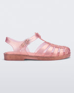 Side view of a pearly pink Possession sandal