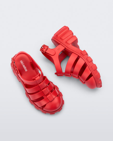 Side and top view of a red kids Megan heeled sandal