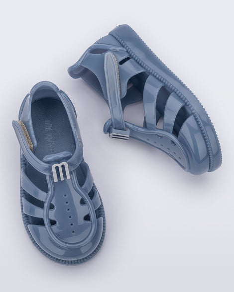 Top and side view of a pair of blue baby Hip Daydream sandals