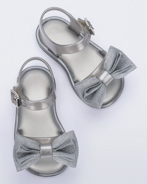 Top view of a pair of pearly silver Mar Sweet baby sandals