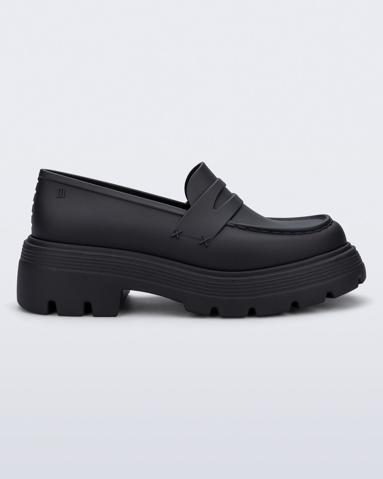 Side view of a matte black Royal adult loafer