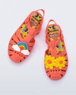 Top view of a red kids Possession + Play Doh sandal with one shoe having a daisy and the other a rainbow on the upper